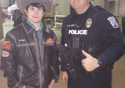 Indiana Bull Rider Tim Taylor with Middle Tennessee State University Police Officer Jason Hicks. Hicks was prayed for in the locker room at the SEBRA National Finals after cowboy church on Jan. 26 as part of a relaunch of the Cowboys for Cops Initiative.