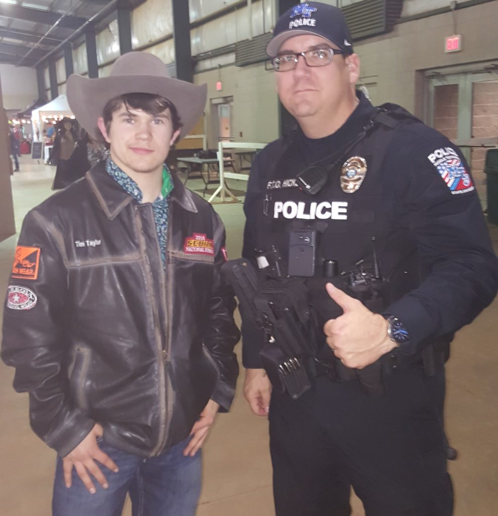 Indiana Bull Rider Tim Taylor with Middle Tennessee State University Police Officer Jason Hicks. Hicks was prayed for in the locker room at the SEBRA National Finals after cowboy church on Jan. 26 as part of a relaunch of the Cowboys for Cops Initiative. 