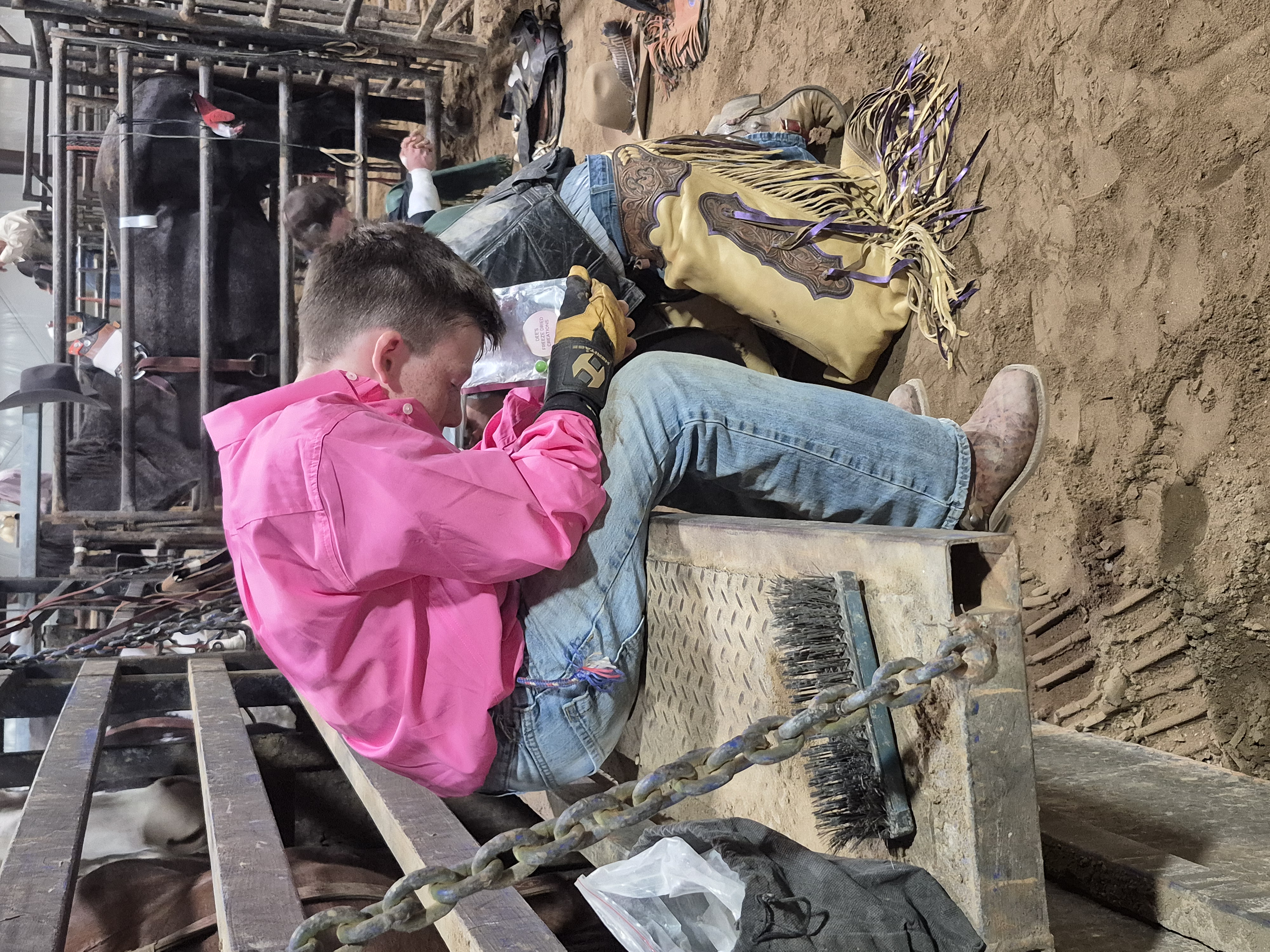 A Christian bull rider cowboy prays during the opening ceremonies of a rodeo