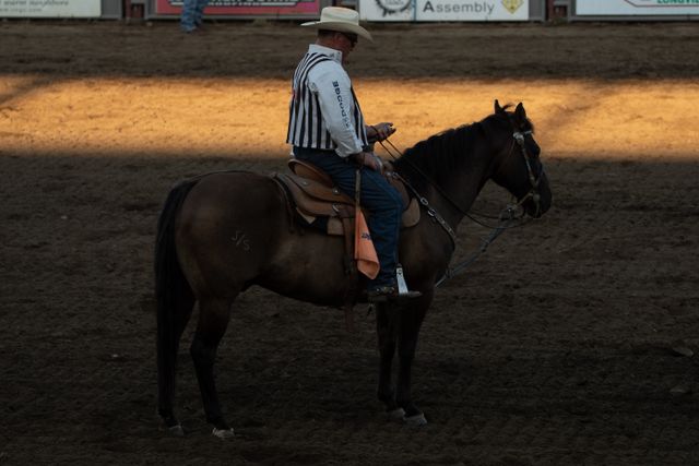 A rodeo judge corrects behavior with a fine
